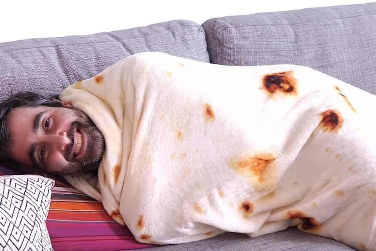 man laying down and wrapped in tortilla blanket